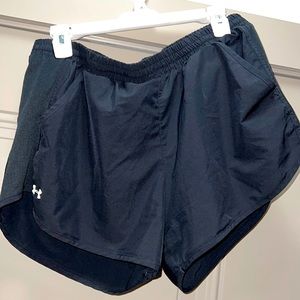 Under Armor black athletic shorts.